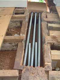 Steel high tensile bars in a dugout structural beam
