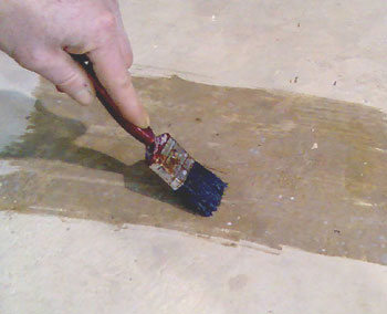 Clear Bondacryl  Seal Coat being brushed onto concrete