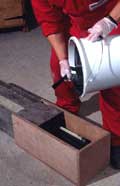 Pouring epoxy resin in a demonstration box